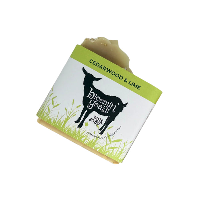 Bar of soap with 'Bloomin Goats' packaging on a white background