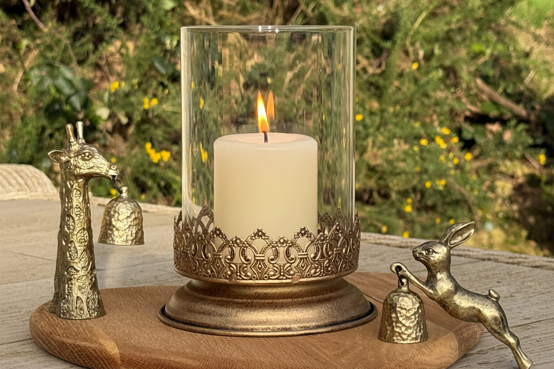 gold and glass lantern on awooden surface