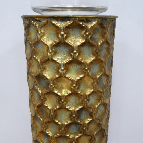 Close up of a decorative gold pillar showing the detailed ornate moulding.