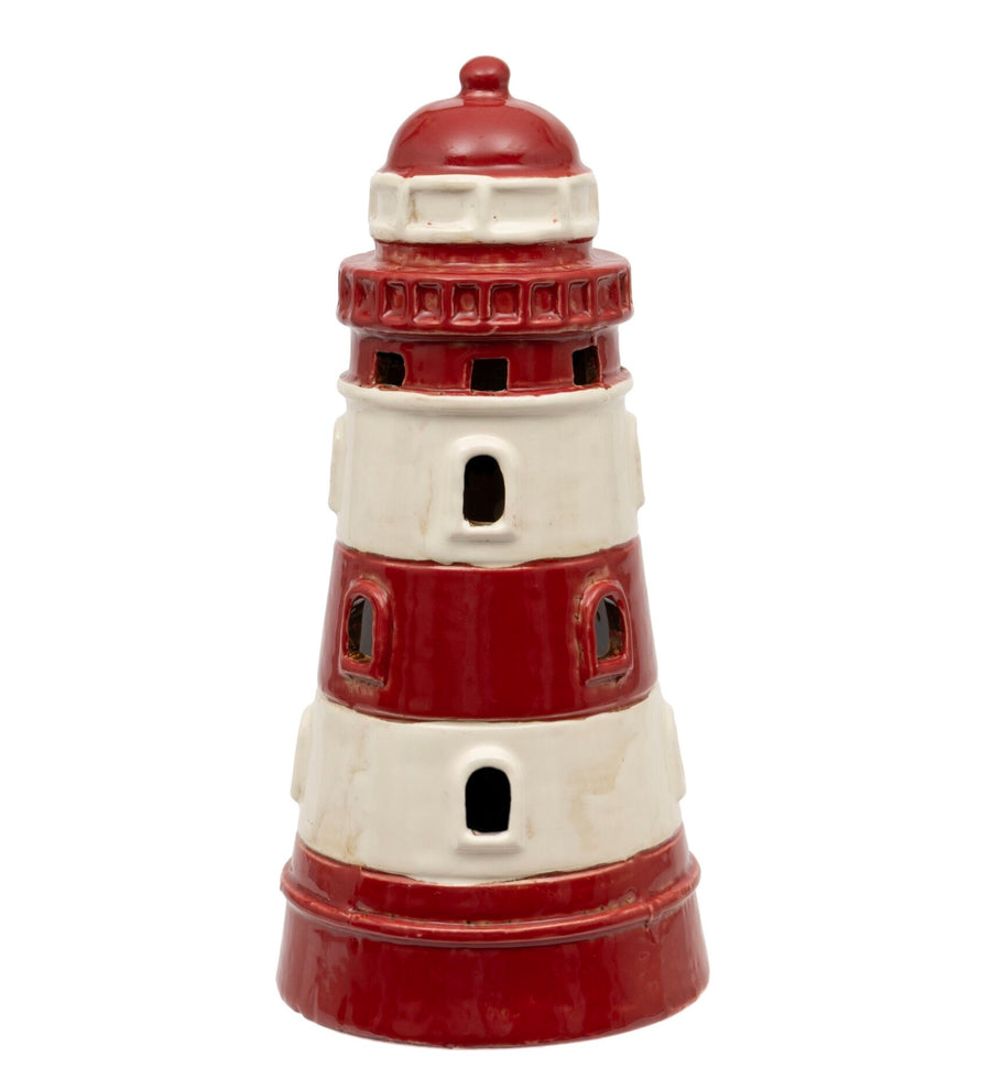 Decorative lighthouse-shaped object with red and white colours on a white background