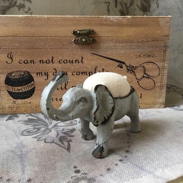 Shabby chic French grey metal elephant pin cushion with a hessian padded back for sewing needles.