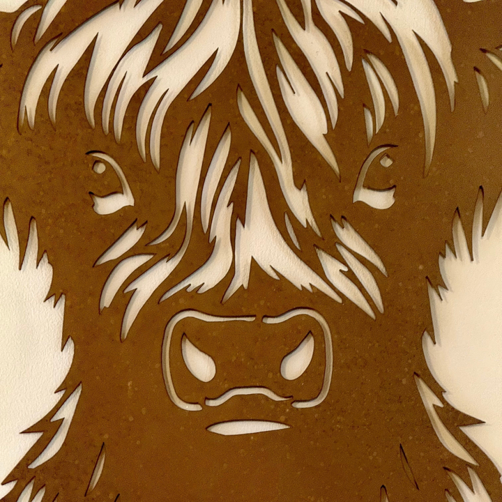 rusty metal Highland cow wall art plaque with detailed laser-cut fringe and rustic weathered finish