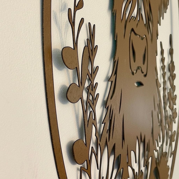 Vintage Hare rusty metal wall art plaque featuring a laser-cut Highland cow silhouette with sunflowers and foliage.