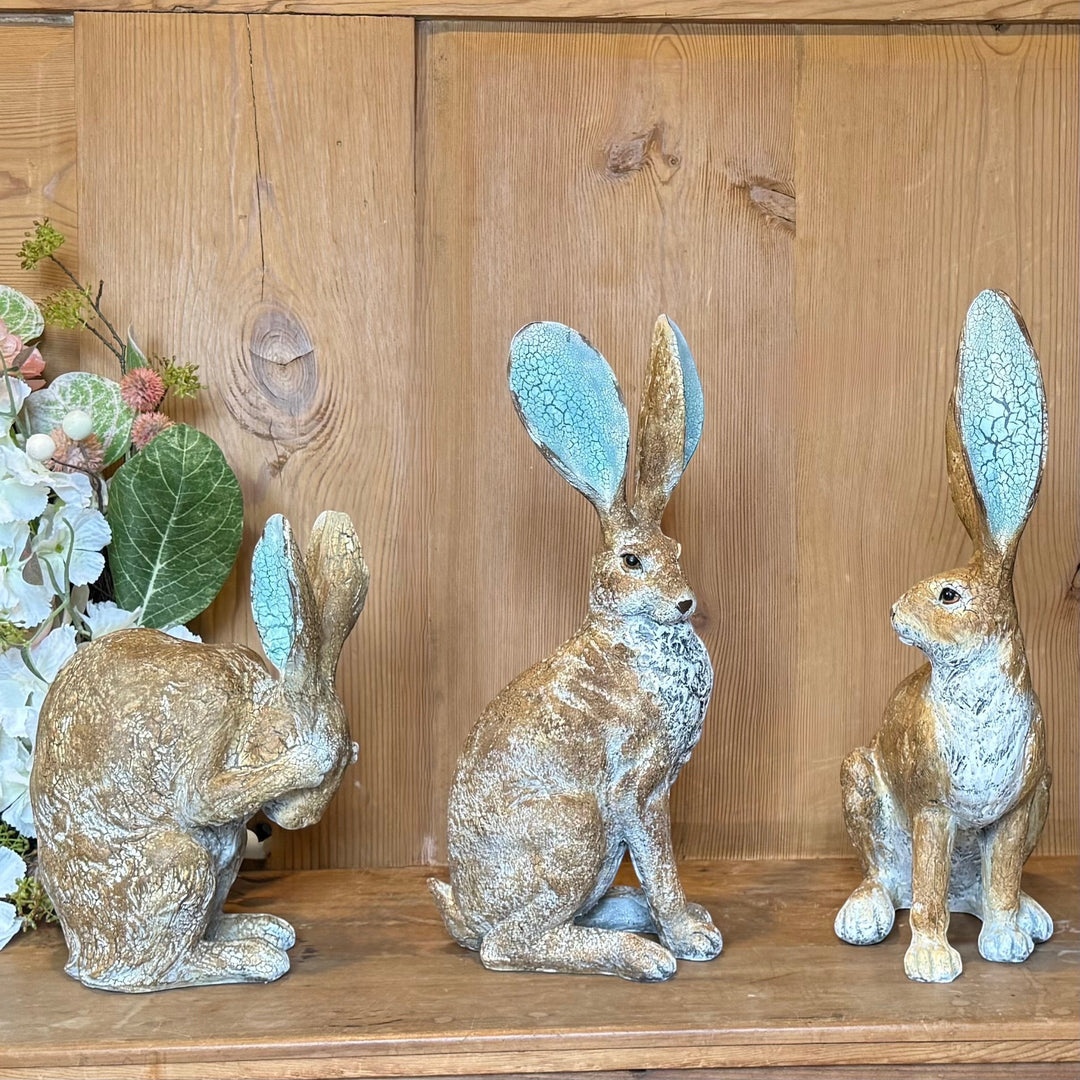 Vintage Hare resin ornament with rustic finish and turquoise crackle ears. H41cm. Three hares shown.