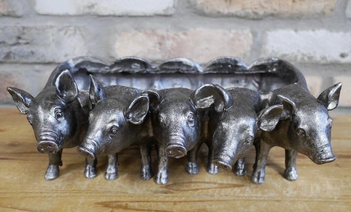 Vintage Hare Silver Pigs Planter with five pigs in a row, antique silver finish, resin, 30cm wide.